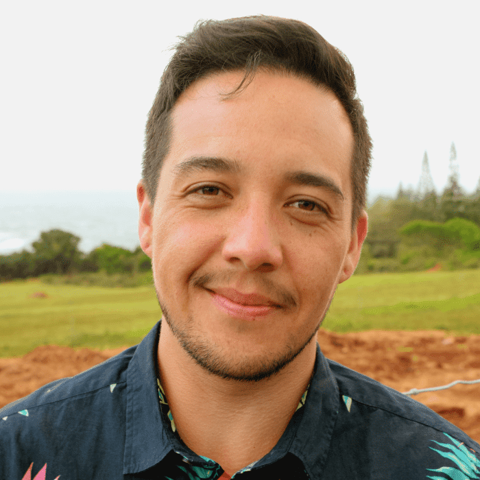 Individual smiling in field